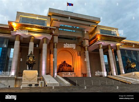 Parliament building on Sükhbaatar Square with the Genghis Khan monument at night, Ulaanbaatar ...