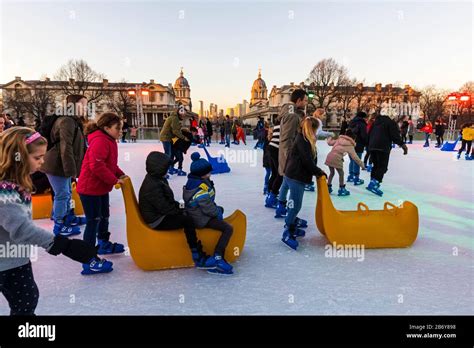 England, London, Greenwich, Adults and Children Ice Skating at The ...