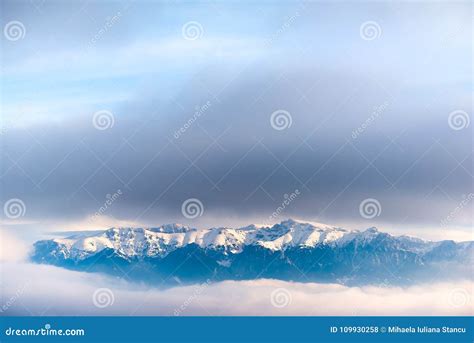 Beautiful Landscape of a Mountain Crest Covered in Snow in the Clouds Stock Photo - Image of ...