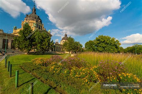 Szechenyi Thermal Bath entrance with garden and blue sky — colorful, spa - Stock Photo | #412701108