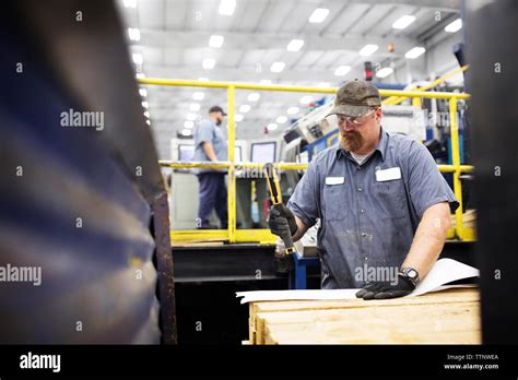 Workers working in Steel Industry Factory Stock Photo - Alamy