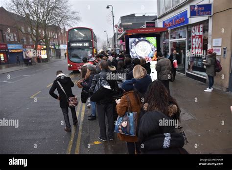 Turnpike Lane, London, UK. 30th December 2016. People queue for the buses at rush hour after the ...