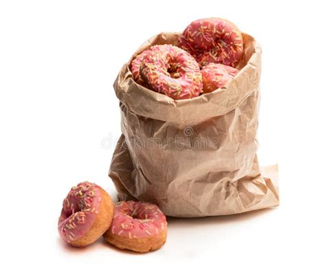 Mini Pink Glazed Doughnuts in Paper Bag Isolated on White Stock Photo ...