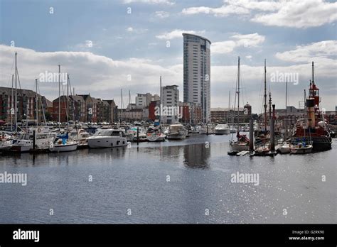 Swansea marina full of boats with the Tower, Wales UK. Quayside flats ...