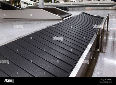 Conveyor belt in airport Stock Photo - Alamy