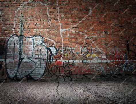 Premium Photo | Graffiti on the old wall of red brick