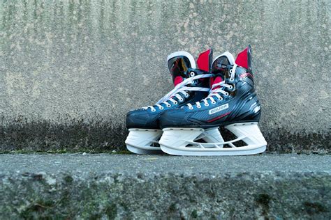 Black and White Ice Skates on Concrete · Free Stock Photo