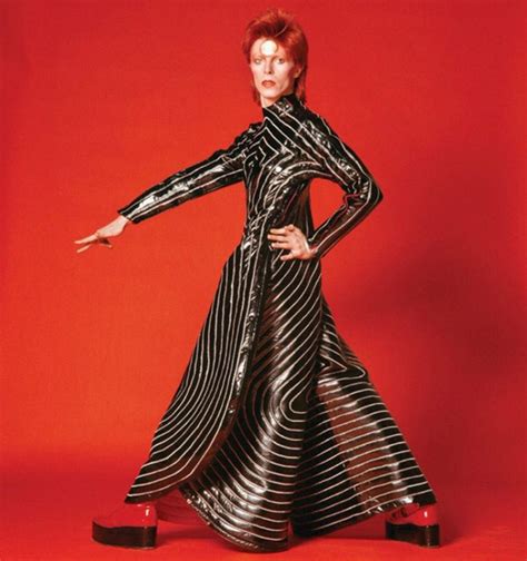 David Bowie fashion influence red background sequin jumpsuit - INDIE Magazine