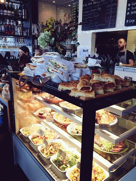 a display case filled with lots of different types of sandwiches and ...