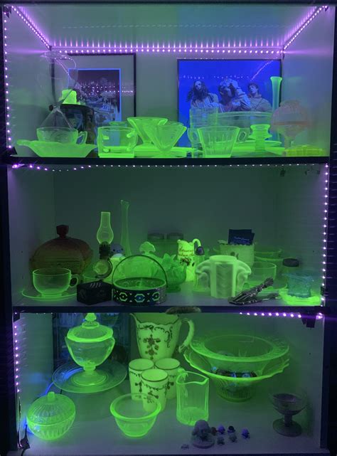 my uranium glass collection under a black light : mildlyinteresting