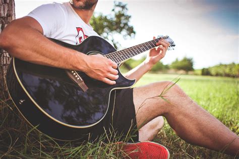 Guy Playing Acoustic Guitar in Nature Free Stock Photo | picjumbo