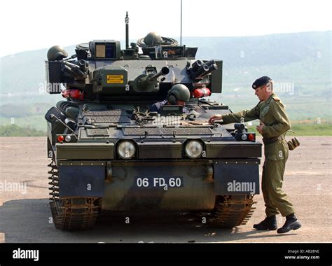 Tank driver and Scimitar tank at "The Armour Centre" at Bovington in Stock Photo: 7287901 - Alamy