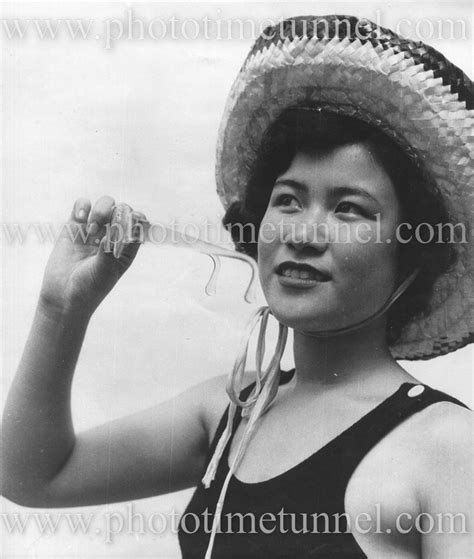 Portrait of a woman with sun hat and glasses, Japan c1950. - Photo Time Tunnel