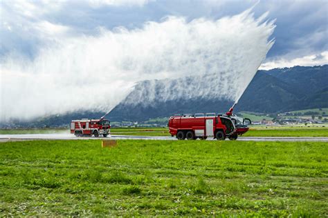 Fire fighting with water spray. Fire truck and fire engine with fire ...