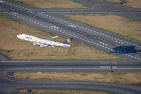 Airplane of Lufthansa Boeing 747 Jet Taking Off from Logan International Airport in Boston, USA ...