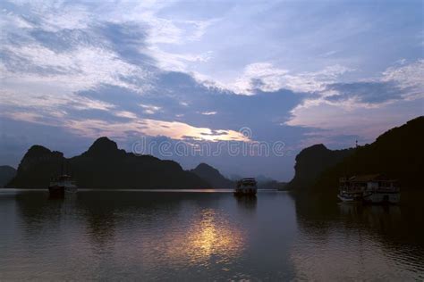 Sunrise in Halong Bay. with Orange and Blue Tones. with Some Ships at Background Stock Image ...