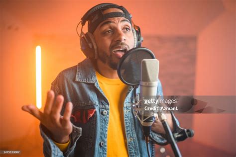 Young Hip Hop Singer Recording Music In Recording Studio High-Res Stock ...