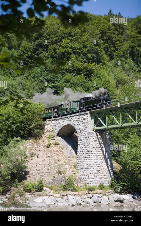 Railway bridge with steam engine and trailer Stock Photo - Alamy