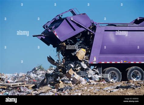 A large garbage truck dumps trash at a landfill Stock Photo: 7613247 - Alamy