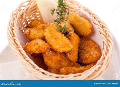 Crumbed Chicken Nuggets in a Basket Stock Image - Image of golden ...