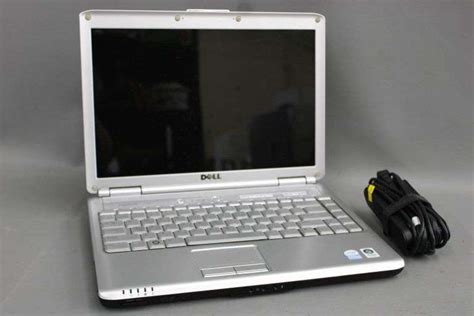 Dell Inspiron 1420 laptop, model no. PP26L, 14", with AC adaptor. - Bunting Online Auctions