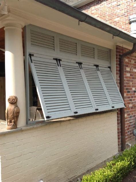 Image result for hinged storm shutter | Outdoor shutters, Shutters exterior, Window shutters ...