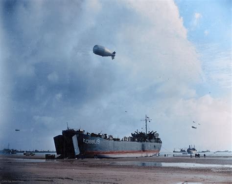 A Landing Craft unloads at low tide on Normandy Beach six days after D-Day. June 12, 1944 ...