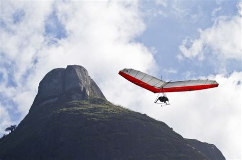 Free Photo | Amazing shot of a human paragliding on blue sky