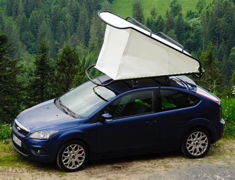 This pop-up rooftop tent converts any car into a camper