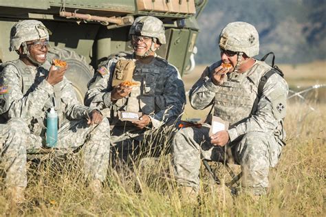 Soldiers enjoy Meals, Ready-to-Eat (MRE) pizza during initial field ...