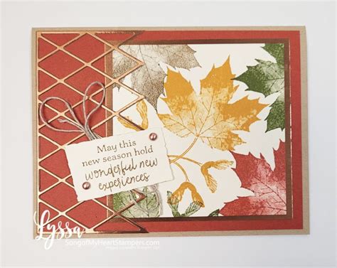 a close up of a card with autumn leaves on it and a tag that says may ...