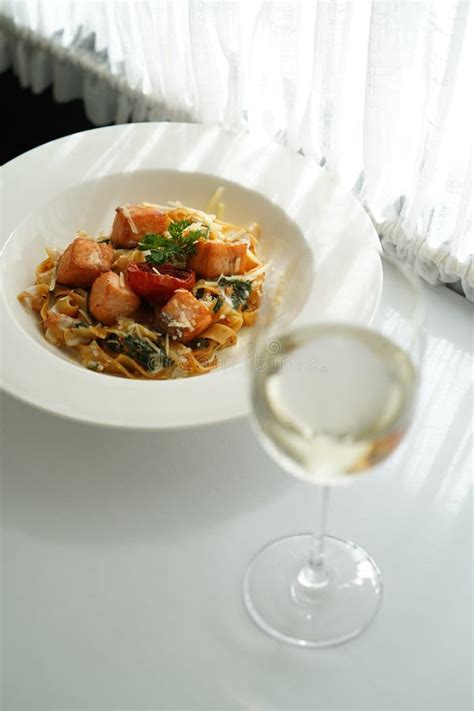 Tagliatelle Pasta with Salmon, Baked Tomato and Parmesan Cheese Stock Photo - Image of meal ...