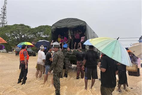 More than 26,000 evacuated as floods hit Malaysia again; 1 dead - The ...