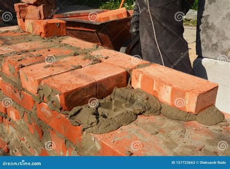 Bricklaying Hhouse Wall. Masonry Techniques.Bricklayers Hands in ...