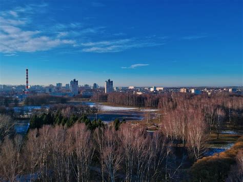 Premium Photo | Aerial view of buildings in city against blue sky