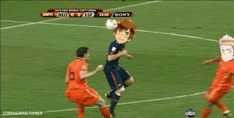 two soccer players in orange and blue uniforms are on the field playing with a ball