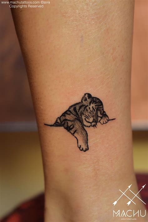 Minimalistic tiger tattoo | cute sleeping tiger tattoo | Tiger tattoo, Tattoo designs wrist ...