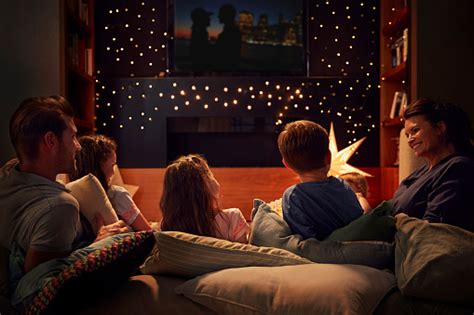 Family Enjoying Movie Night At Home Together Stock Photo - Download Image Now - iStock