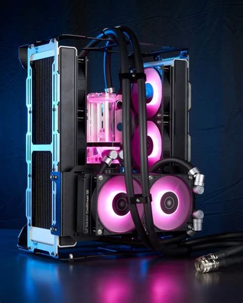 a computer case with pink and blue lights on the side, in front of a ...