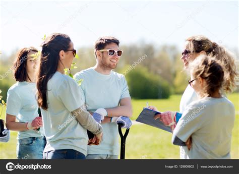 Group of volunteers planting trees in park Stock Photo by ©Syda ...