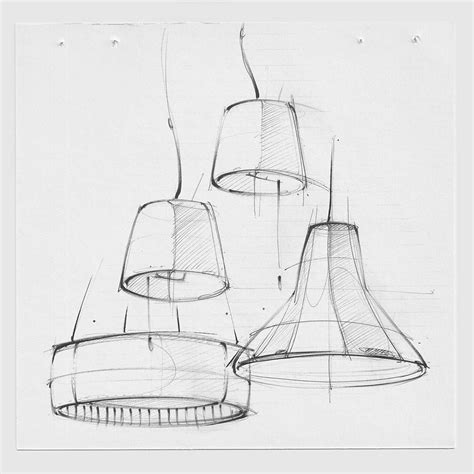 three lamps hanging from the ceiling and one is drawn in pencil with pen on paper