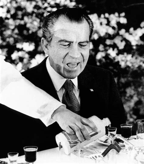 President Richard Nixon At A Chinese Banquet. He Watches As His Glass ...