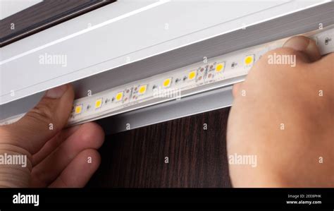 LED strip installation,installation of a diode tape Stock Photo - Alamy