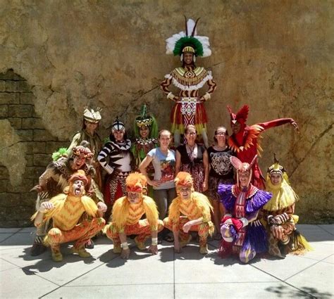 a group of people in costume posing for a photo