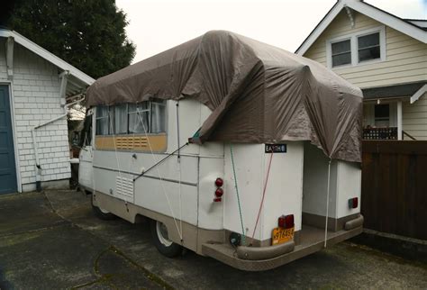 OLD PARKED CARS.: 1976 Commer Camper Van.