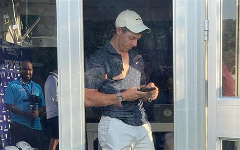 Rory McIlroy rips his Nike golf shirt in frustration after falling ...