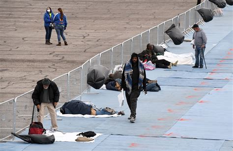 Hundreds of homeless in Las Vegas sleep six feet apart in parking lot after their shelter was ...