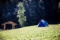 Tents on Green Grass Field Near Mountain · Free Stock Photo