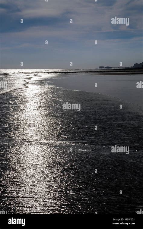 Sunrise over a deserted Norfolk beach Stock Photo - Alamy