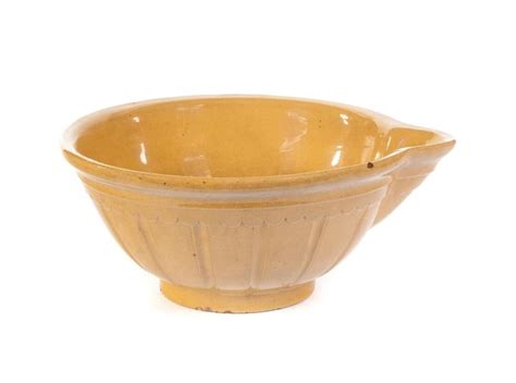Sold at Auction: LARGE YELLOWWARE BATTER BOWL WITH SPOUT.